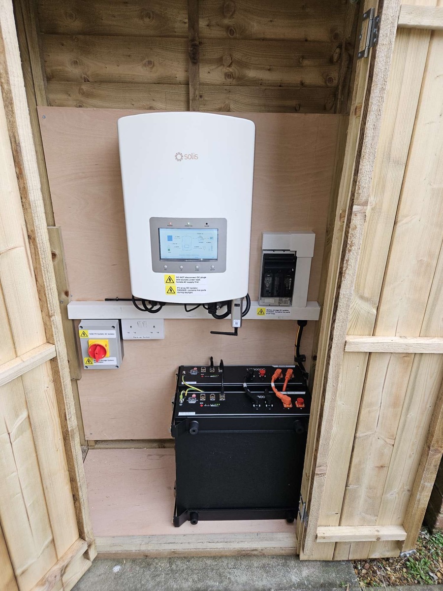 A solar inverter and battery fitted inside a timber enclosure